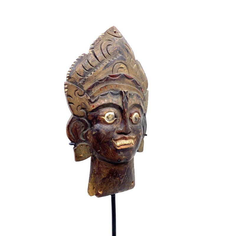 Panneau, petite partie d'un objet balinais décoratif ancien, tête d'un dieu hindouiste, sculpté dans du bois.