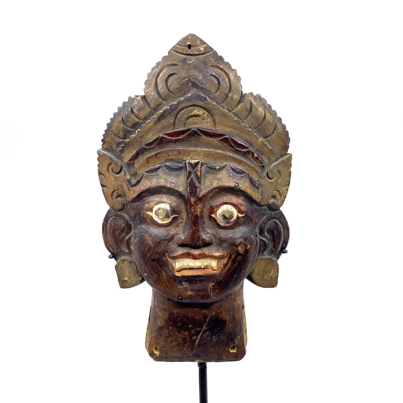 Panneau, petite partie d'un objet balinais décoratif ancien, tête d'un dieu hindouiste, sculpté dans du bois.