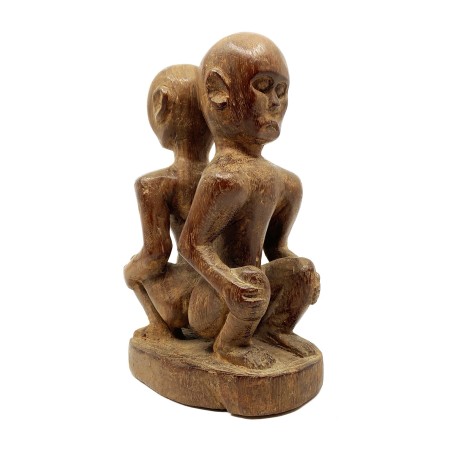 Statue primitive double personnages accroupis dos à dos  bois sculpté Dayak Bornéo