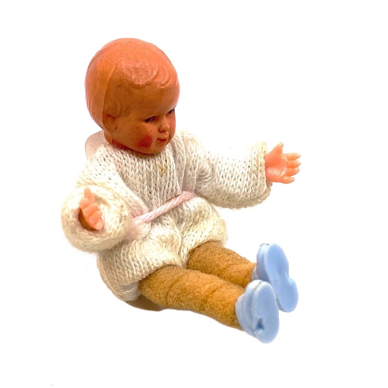 Poupon petit en celluloïd  plastique et tricot